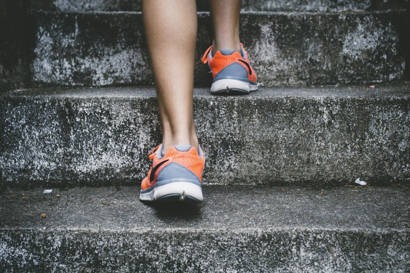 Footwear and feet on outdoor stairs
